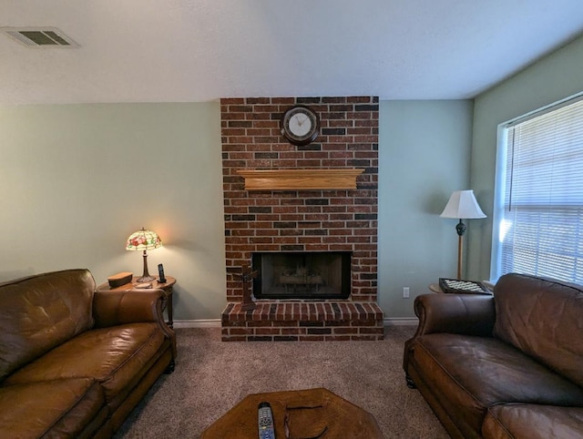 carpeted living room featuring a fireplace