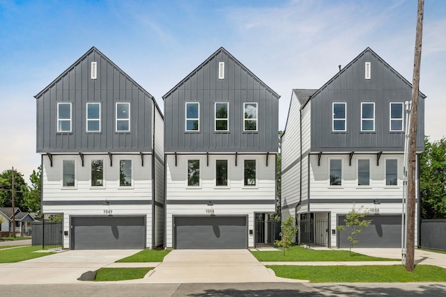 modern inspired farmhouse with a garage