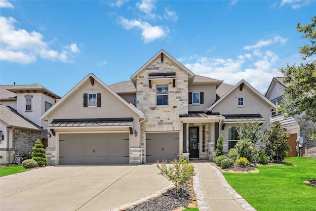 view of front of house featuring stone siding, a standing seam roof, a front lawn, and an attached garage