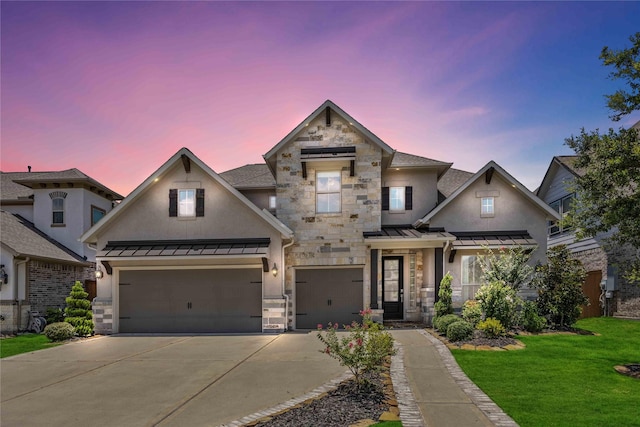 view of front of property with stone siding, a standing seam roof, and an attached garage