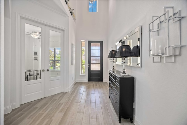 entrance foyer with wood finish floors and baseboards