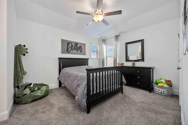 bedroom featuring carpet floors, lofted ceiling, ceiling fan, and baseboards