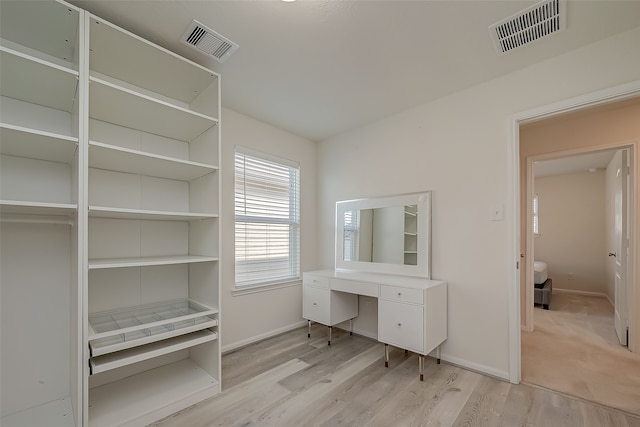 unfurnished office with light wood-type flooring