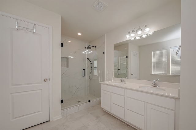 bathroom featuring vanity and walk in shower