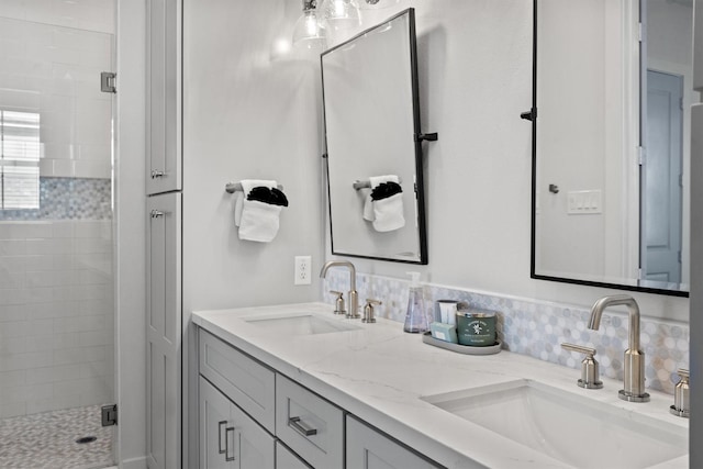 26831 Bay Water Dr, Galveston, TX 77554 - bathroom with double vanity, a sink, and a stall shower