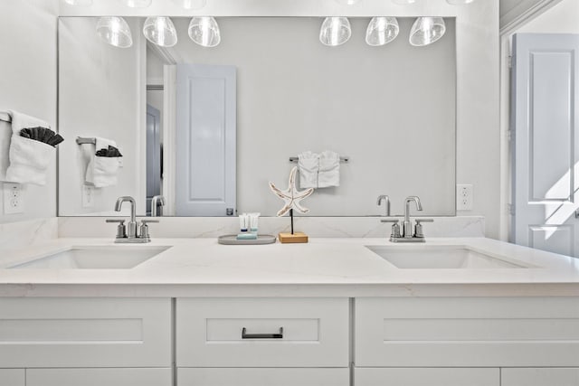 26831 Bay Water Dr, Galveston, TX 77554 - bathroom featuring a sink and double vanity
