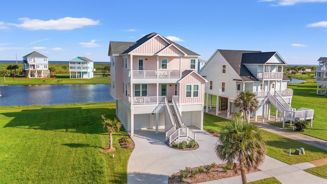 26831 Bay Water Dr, Galveston, TX 77554 - coastal inspired home with stairs, board and batten siding, concrete driveway, and a balcony
