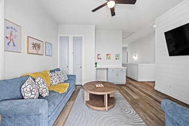 26831 Bay Water Dr, Galveston, TX 77554 - living room featuring baseboards, a ceiling fan, attic access, and dark wood-style flooring