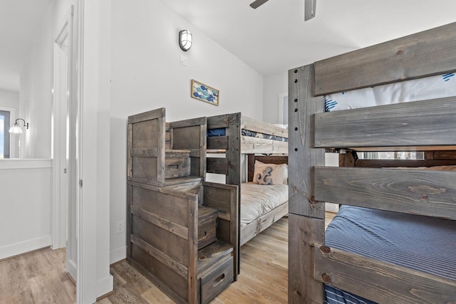 26831 Bay Water Dr, Galveston, TX 77554 - bedroom featuring a ceiling fan, baseboards, and wood finished floors