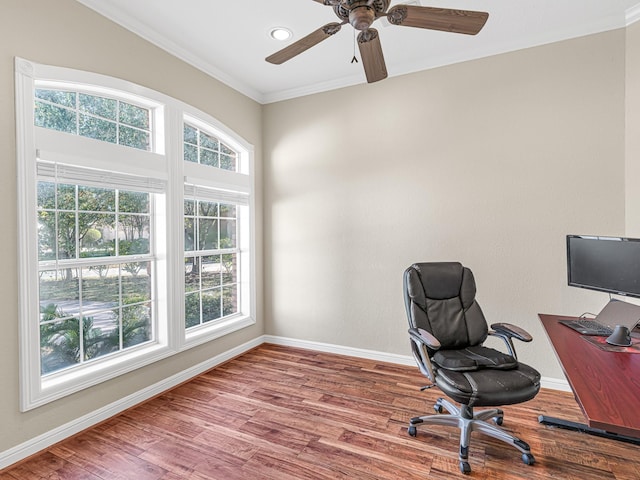 office area with ceiling fan, baseboards, crown molding, and wood finished floors