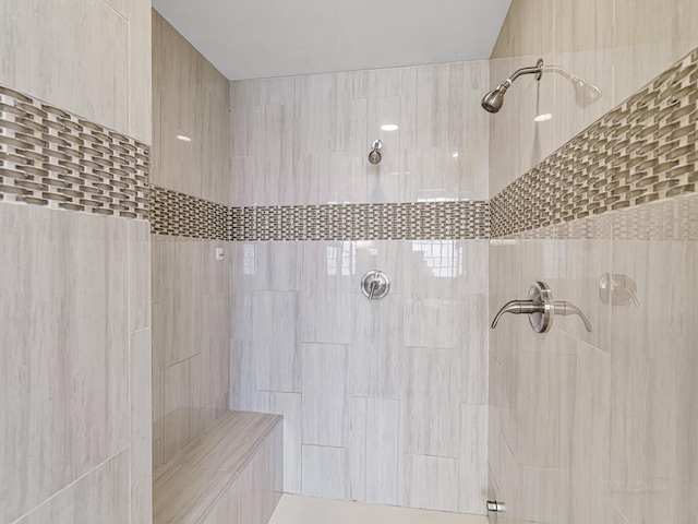 bathroom with tiled shower