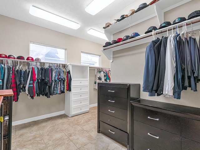 walk in closet featuring light tile patterned floors