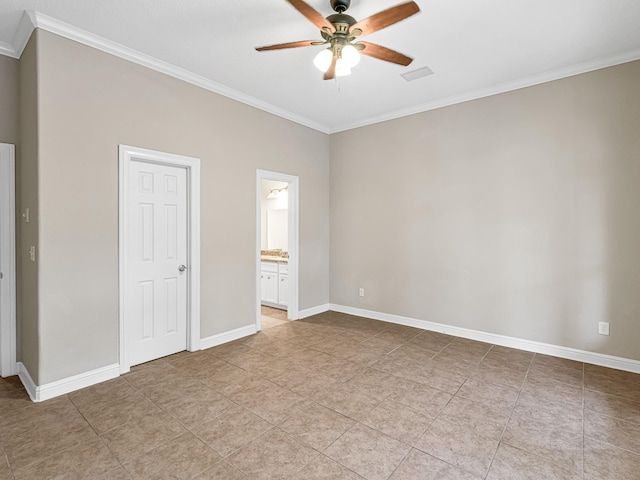 unfurnished bedroom featuring baseboards, ensuite bathroom, visible vents, and crown molding