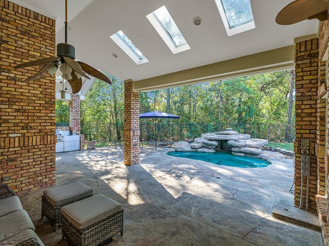 view of patio / terrace featuring ceiling fan, an outdoor kitchen, a fenced backyard, and a fenced in pool