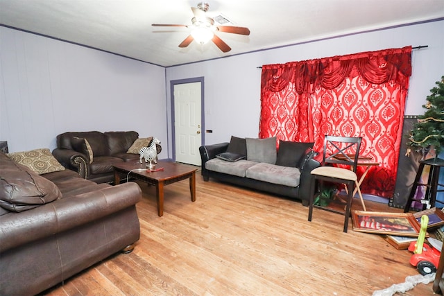 living room featuring ceiling fan and light wood-type flooring