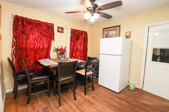 dining space featuring ceiling fan and wood-type flooring