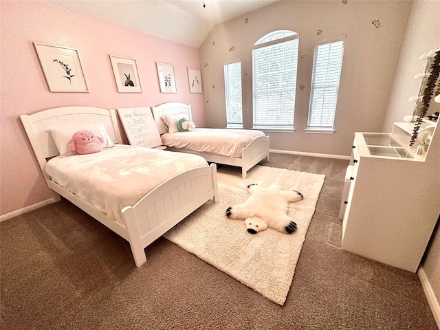 bedroom with vaulted ceiling and dark carpet