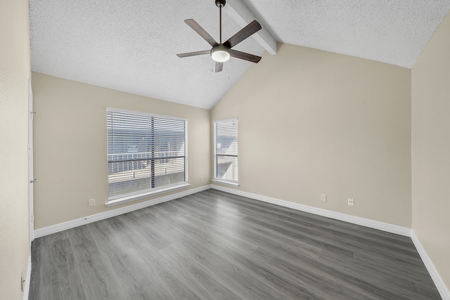 empty room with lofted ceiling with beams, ceiling fan, a textured ceiling, and dark hardwood / wood-style flooring