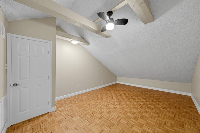 additional living space featuring lofted ceiling, ceiling fan, a textured ceiling, and light parquet floors