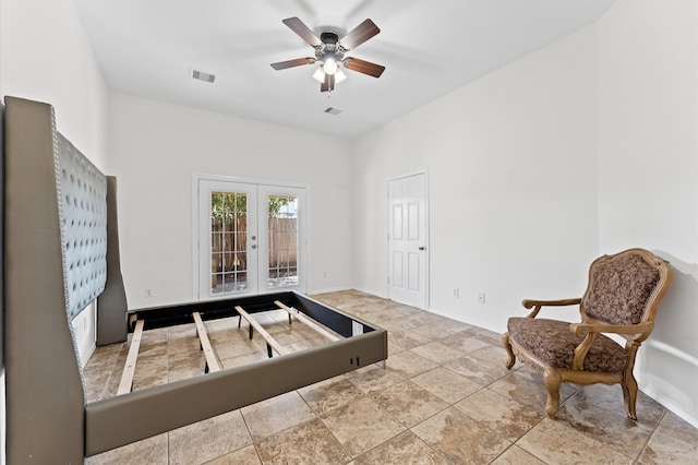 living area with french doors and ceiling fan