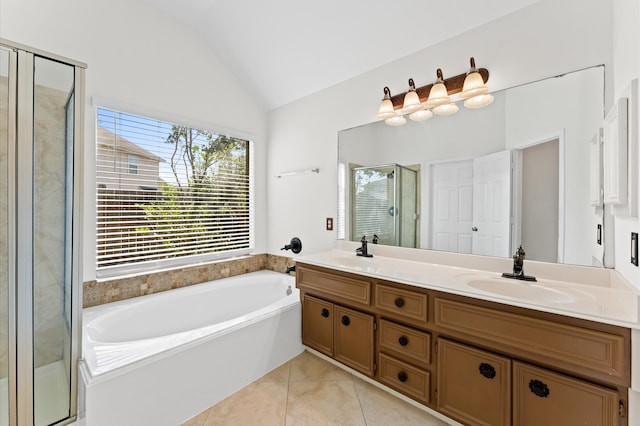 bathroom featuring vanity, lofted ceiling, plus walk in shower, and tile patterned floors