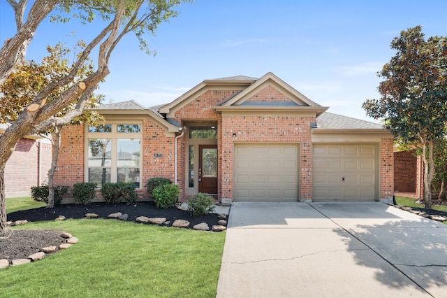 ranch-style house featuring a front lawn and a garage