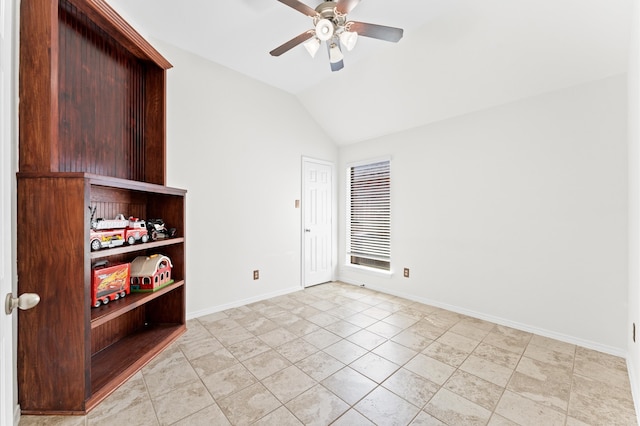 spare room featuring ceiling fan and vaulted ceiling