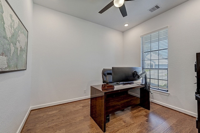 office area with light hardwood / wood-style flooring and ceiling fan