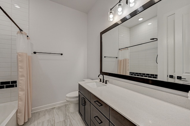 full bathroom with vanity, shower / tub combo, and toilet