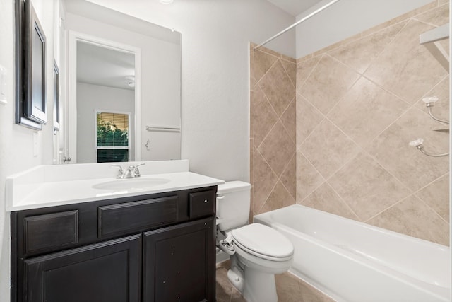 full bathroom with vanity, toilet, and tiled shower / bath combo