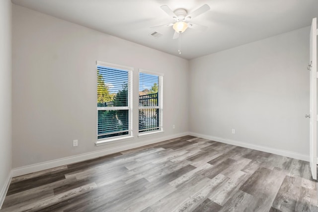 spare room with ceiling fan and light hardwood / wood-style floors