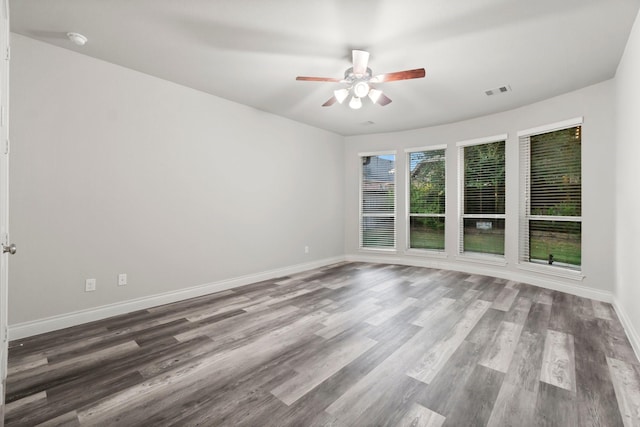 spare room featuring ceiling fan and wood-type flooring