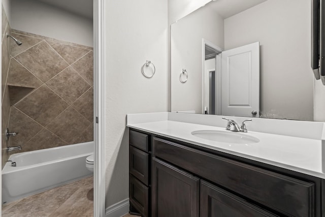 full bathroom featuring vanity, toilet, and tiled shower / bath combo