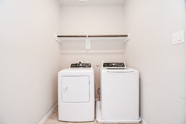 laundry room featuring washing machine and dryer