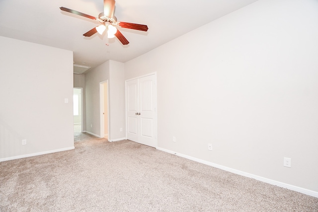 empty room with carpet flooring and ceiling fan