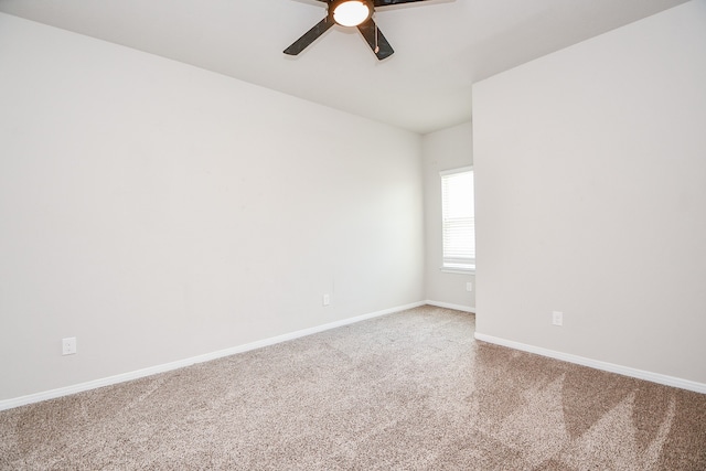 unfurnished room with ceiling fan and carpet flooring