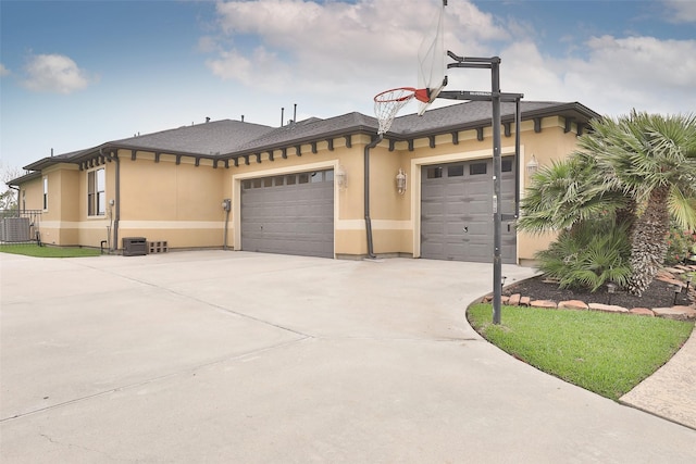 exterior space featuring a garage and central AC unit