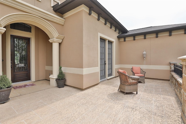 property entrance featuring a patio area