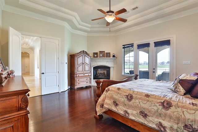 bedroom with french doors, a raised ceiling, crown molding, ceiling fan, and access to exterior