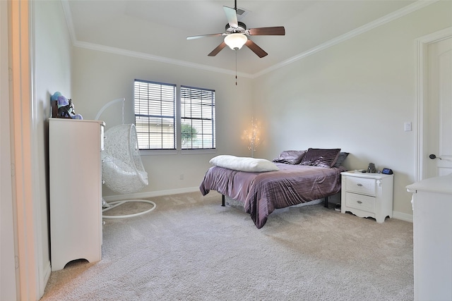 bedroom with ceiling fan, crown molding, and light carpet