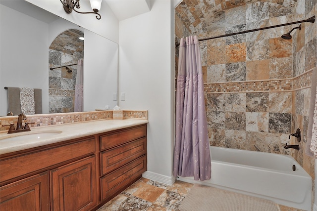 bathroom featuring vanity and shower / tub combo