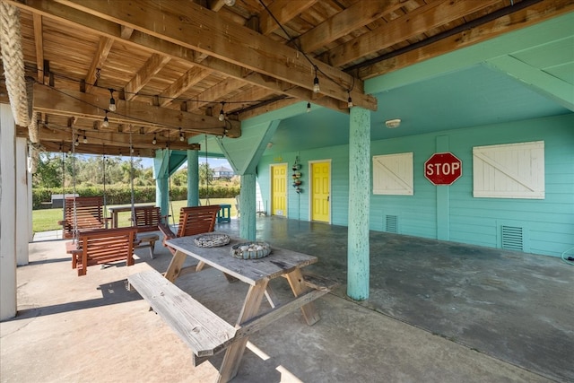 view of patio with a fire pit