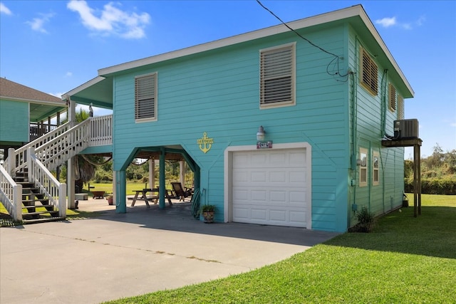 exterior space featuring a lawn and a garage