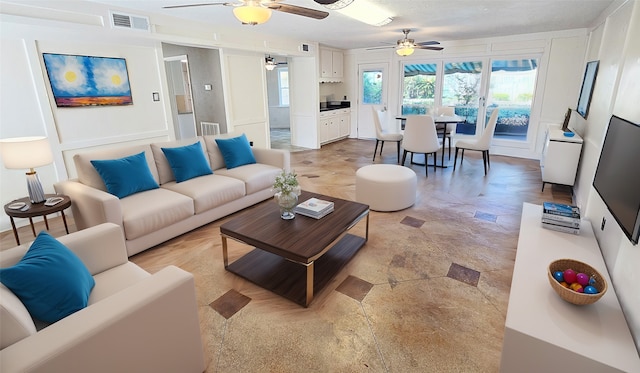 living room with ceiling fan