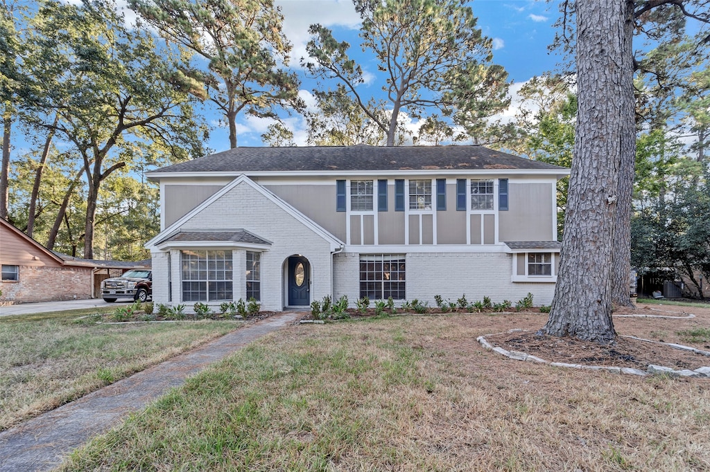 view of property with a front lawn