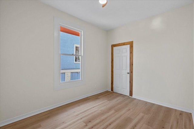 unfurnished room featuring light hardwood / wood-style floors