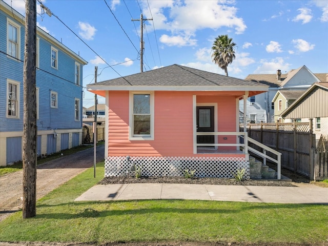 rear view of house with a lawn