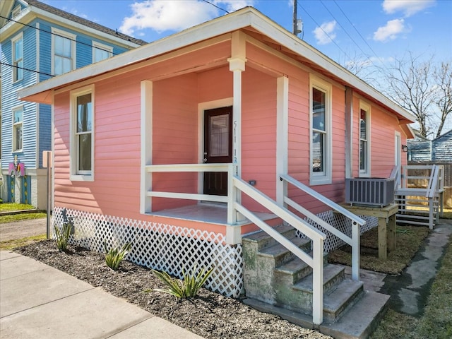 entrance to property with central AC and covered porch