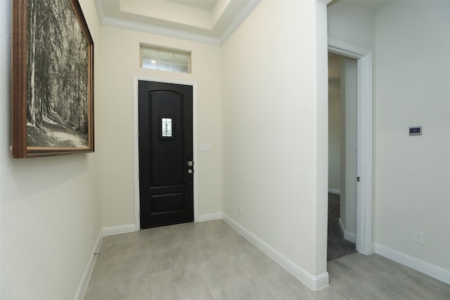 entryway featuring crown molding