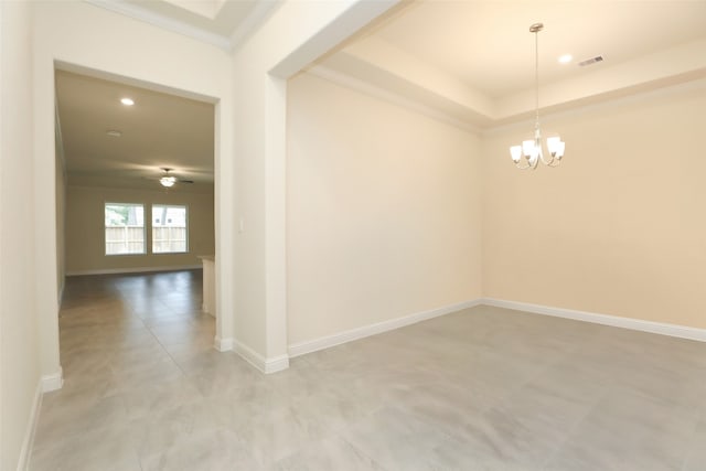 empty room featuring ornamental molding and ceiling fan with notable chandelier